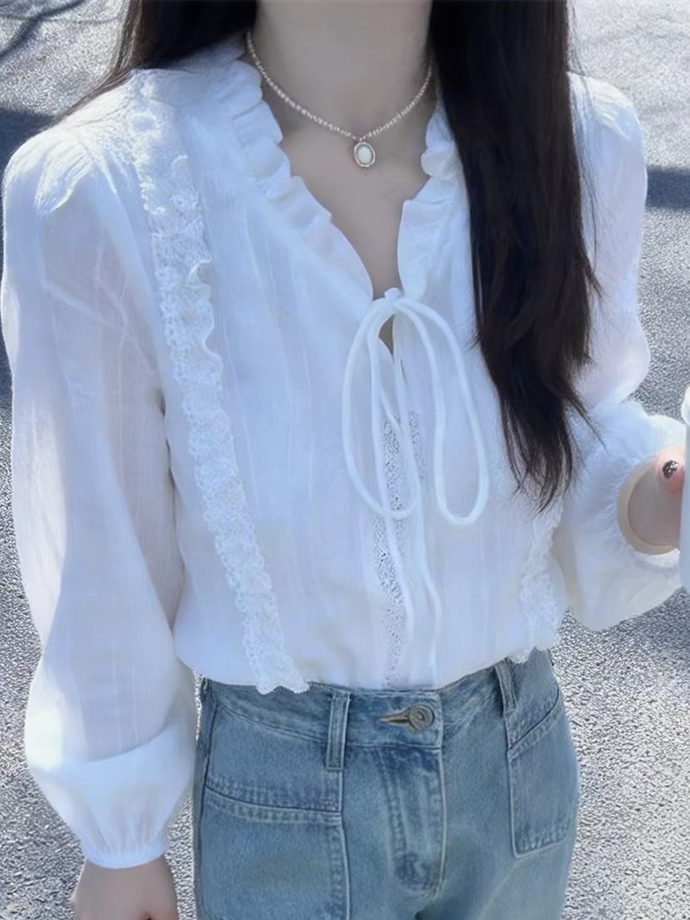 Elegant Lace-Trimmed Ruffle Blouse with Tie-Neck Detail
